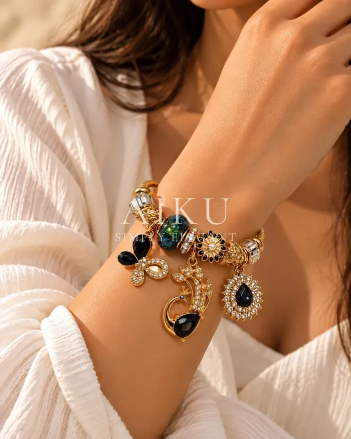 Butterfly & Peacock Charm Cuff Bracelet worn by a model
