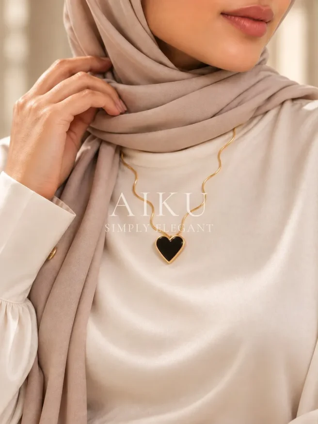 Dual-Tone Heart Necklace worn by a model