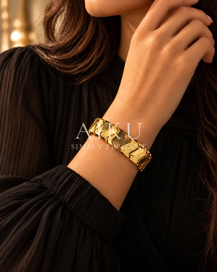 Golden Chevron Bangle worn by a model